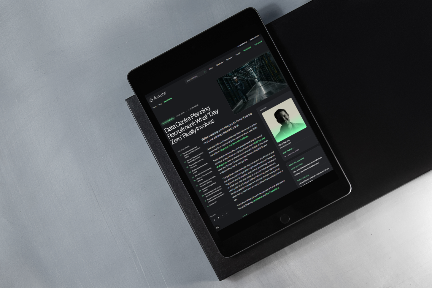 The Day Zero Guide article open on a tablet, resting on a dark desk