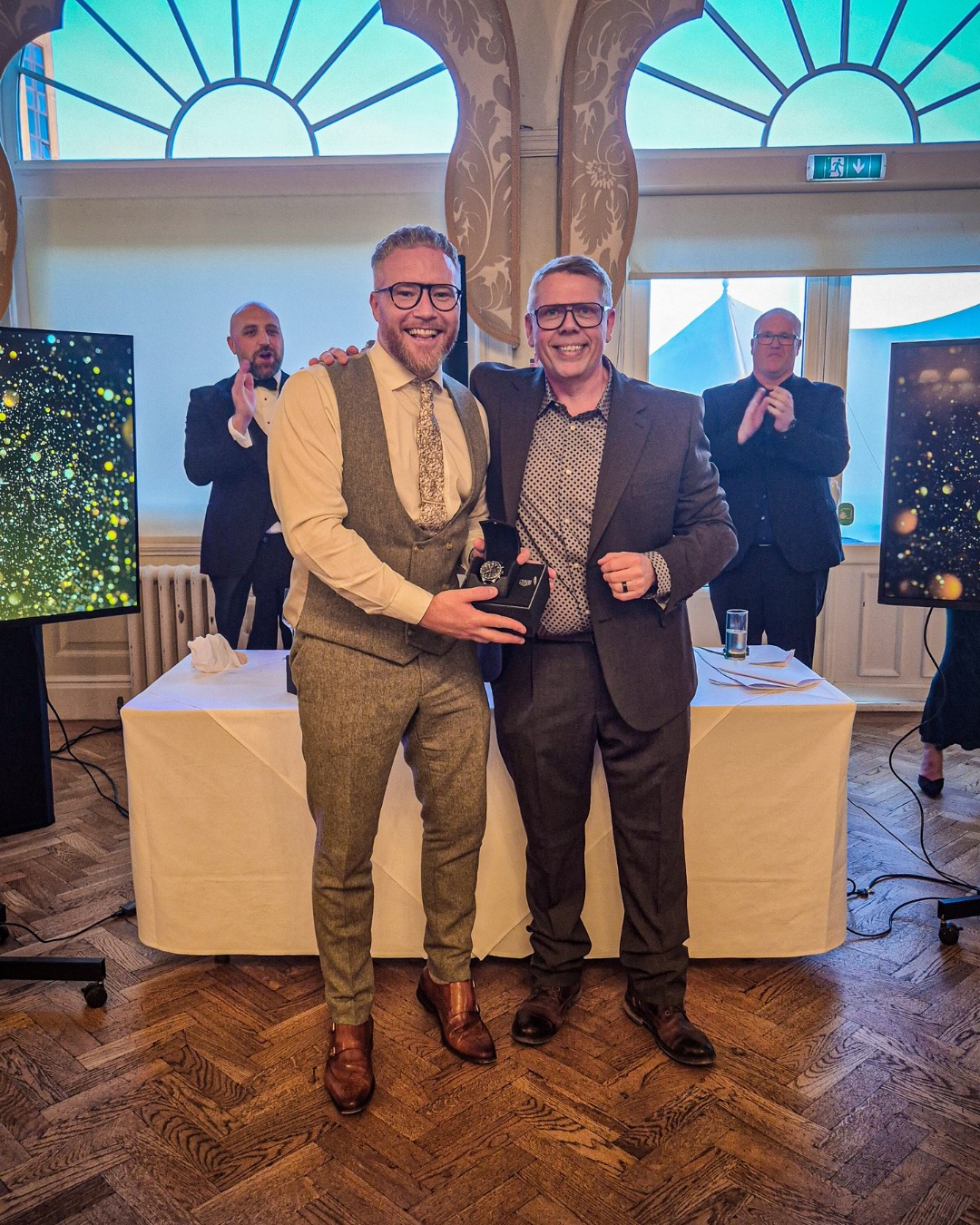 Awards-evening photography — a watch presentation between colleagues